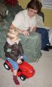 Riding his tractor in his new aviator\'s jacket